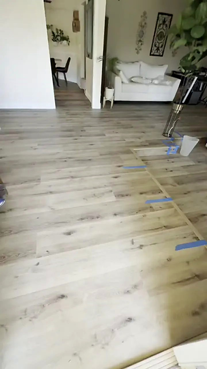 The same hallway after wide plank vinyl was installed