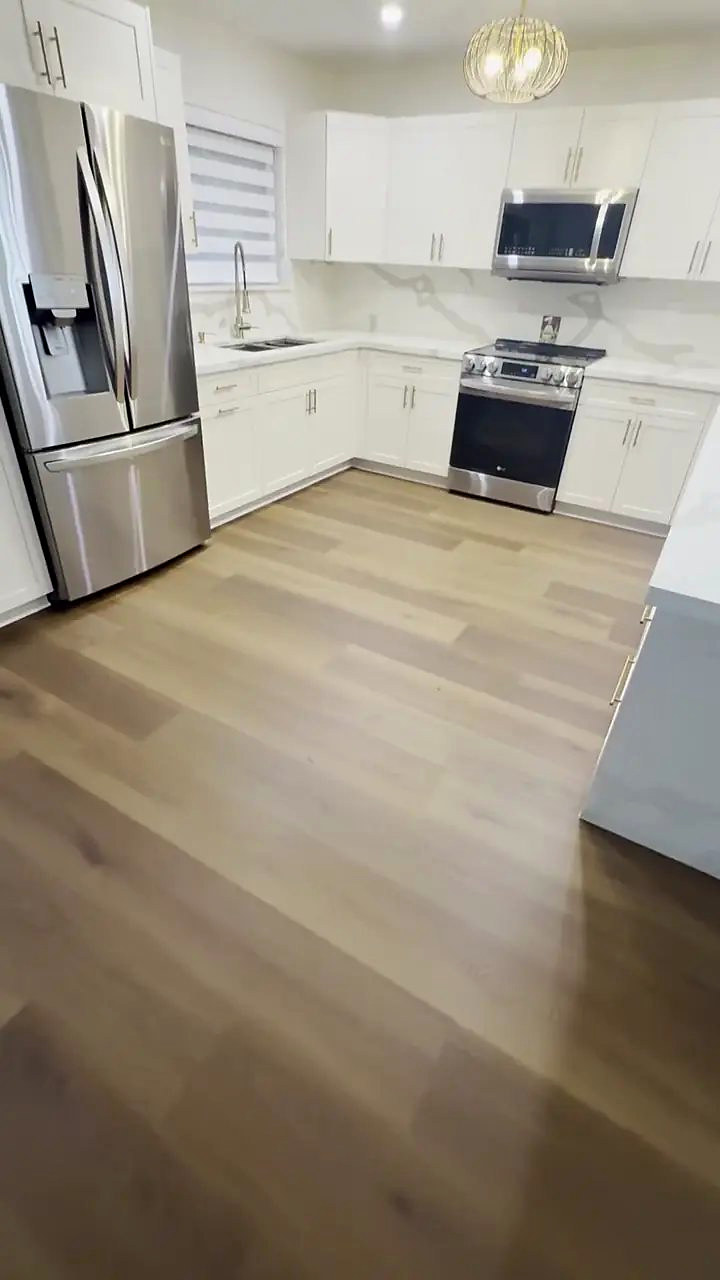 Forged Brown vinyl plank flooring installed by Ozzifloors