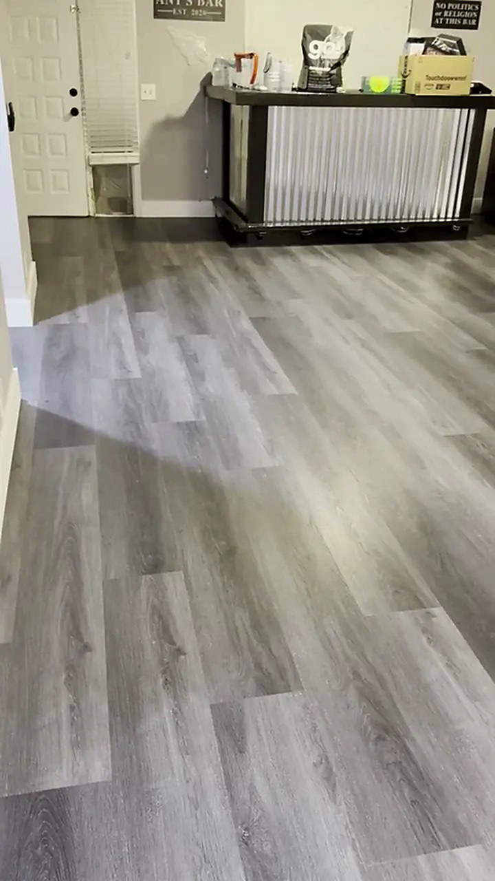 Slate vinyl plank flooring installed by Ozzifloors